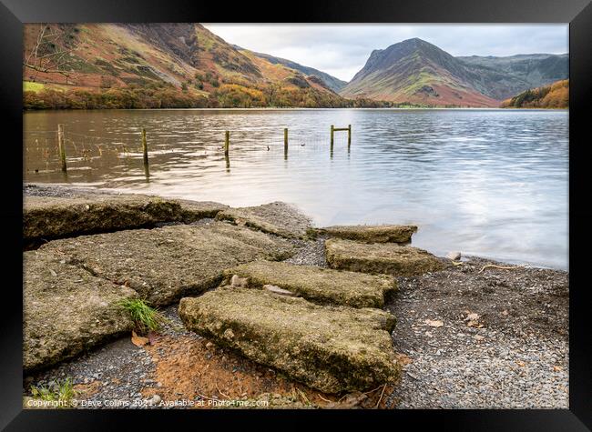Stones n the Edge of Lake Buttermere in the Lake District in Cumbria, England Framed Print by Dave Collins