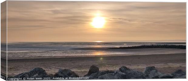 Sun going down over Morecambe bay Canvas Print by Helen lewin
