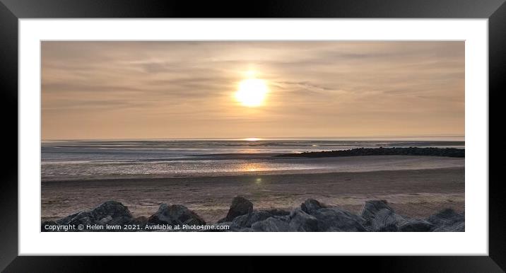 Sun going down over Morecambe bay Framed Mounted Print by Helen lewin