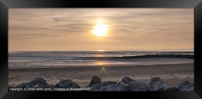 Sun going down over Morecambe bay Framed Print by Helen lewin