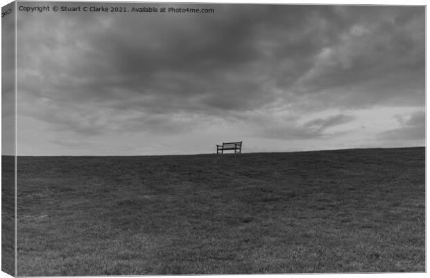 The lone bench Canvas Print by Stuart C Clarke
