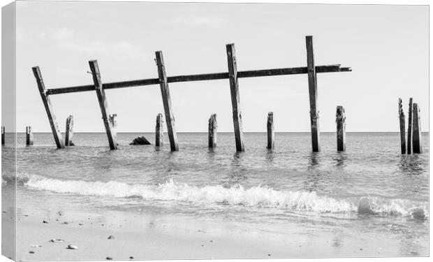 Happisburgh revetments in the sea Canvas Print by Jason Wells