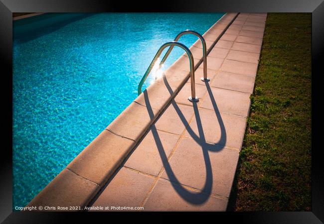 Swimming pool ladder shadows Framed Print by Chris Rose