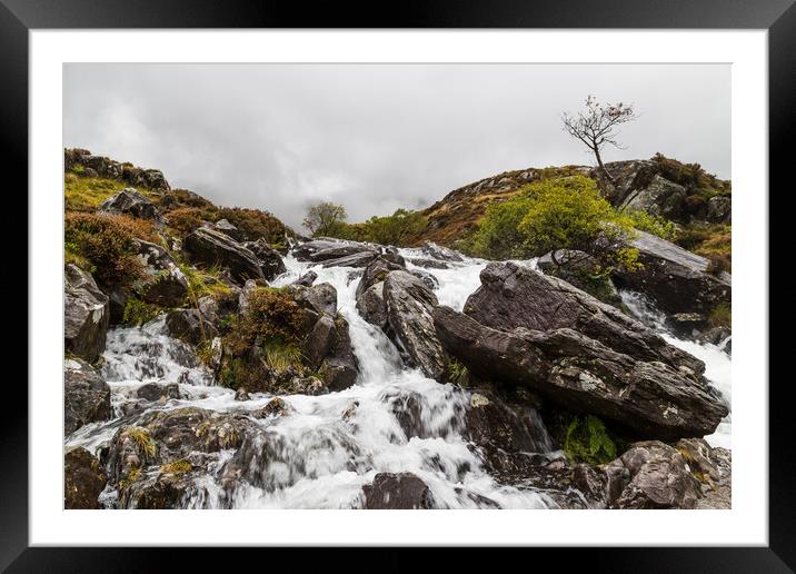 Water crashes over rocks at Ogwen Valley Framed Mounted Print by Jason Wells