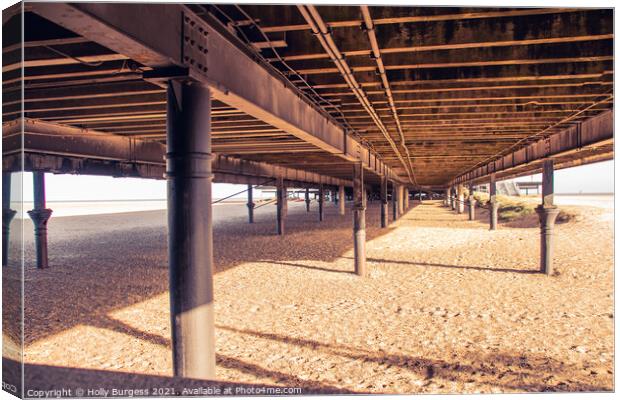 Yarmouth Pier looking from underneath on the beach Canvas Print by Holly Burgess