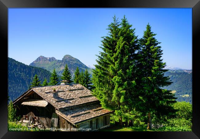 A traditional wooden building in mountains of Alps in summer in Portes du Soleil, France, Europe Framed Print by Chun Ju Wu