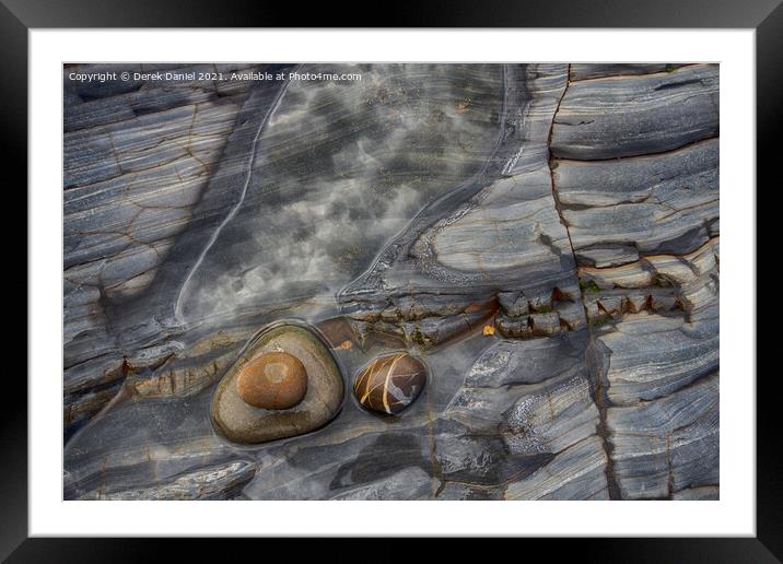Rocks on the beach at Sandymouth Framed Mounted Print by Derek Daniel