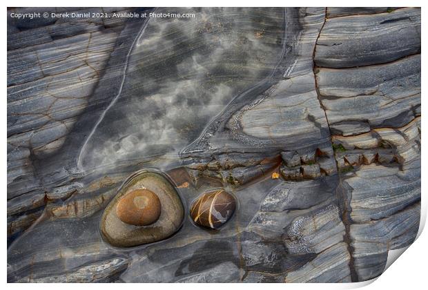 Rocks on the beach at Sandymouth Print by Derek Daniel