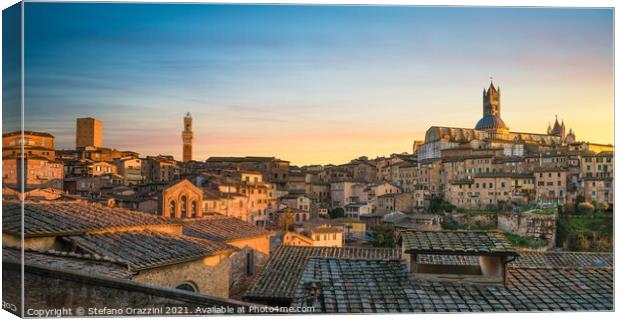 Siena panoramic skyline at sunset. Mangia tower and Duomo Canvas Print by Stefano Orazzini