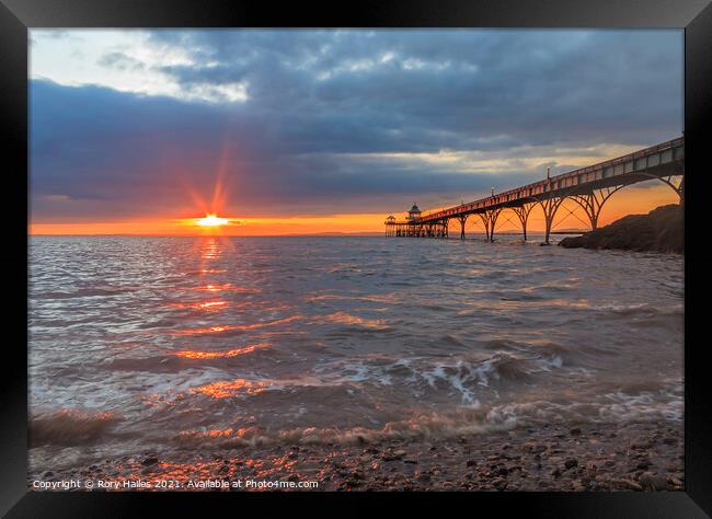 Clevedon Pier with lens flare Framed Print by Rory Hailes