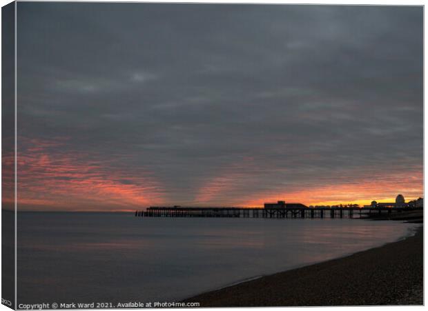 Autumn Dusk at Hastings Pier. Canvas Print by Mark Ward