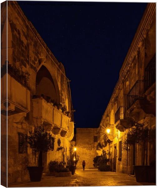 Dramatic Narrow street by Night located in Gozo Ma Canvas Print by Maggie Bajada