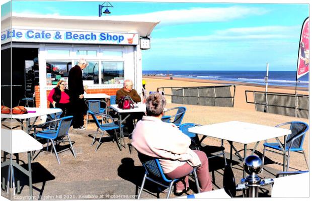 Seaside cafe and beach shop. Canvas Print by john hill