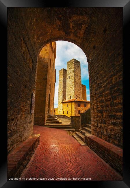 San Gimignano towers from a tunnel, Tuscany Framed Print by Stefano Orazzini