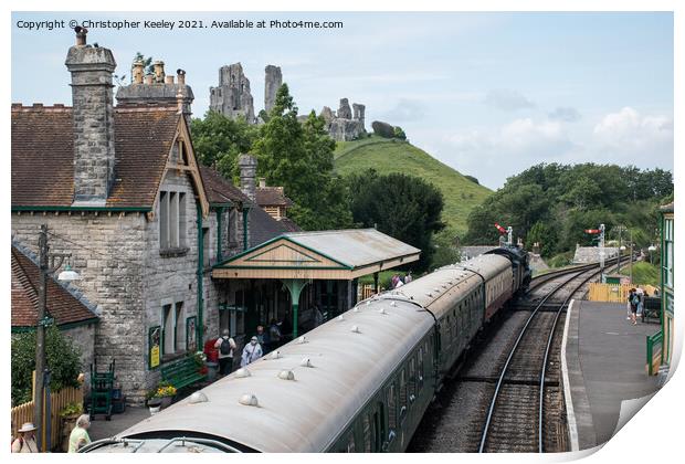 A steam train at Corfe Castle Print by Christopher Keeley