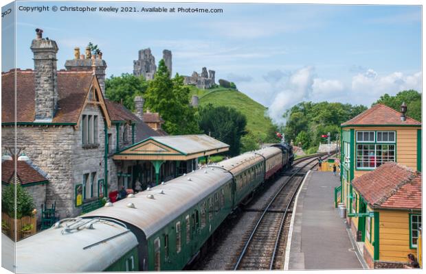 Summer at Corfe Castle railway station Canvas Print by Christopher Keeley