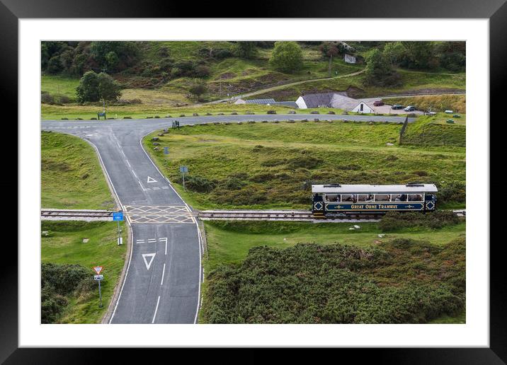 Tram on the Great Orme crossing the road Framed Mounted Print by Jason Wells