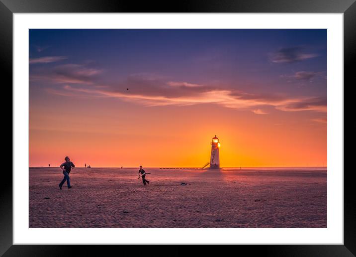 Playing beach cricket at sunset. Framed Mounted Print by Bill Allsopp