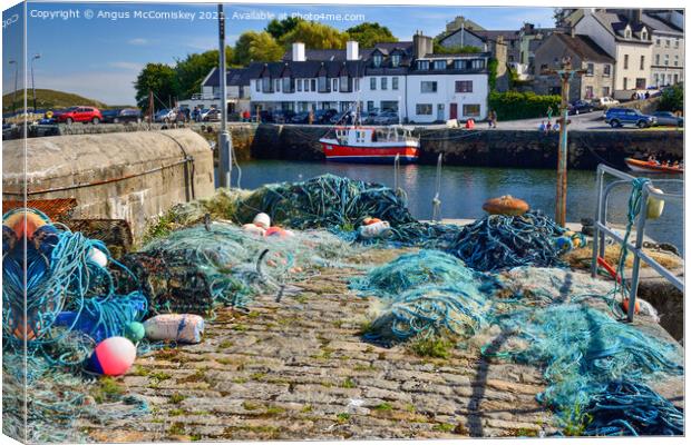 Fishing nets on Roundstone quayside, County Galway Canvas Print by Angus McComiskey