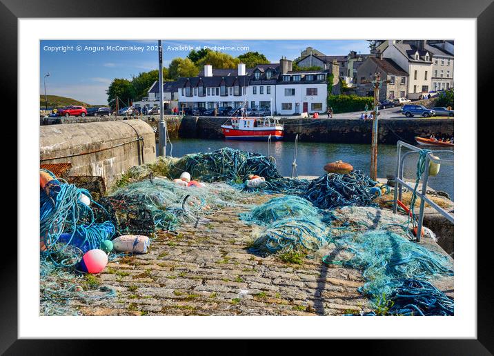 Fishing nets on Roundstone quayside, County Galway Framed Mounted Print by Angus McComiskey
