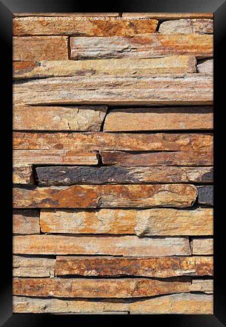 Brown slabs of old sandstone are lined with a wall. Framed Print by Sergii Petruk