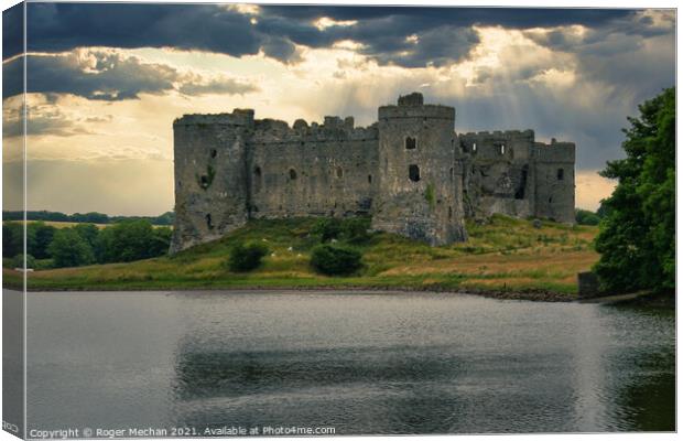 Threatening Skies over Carew Castle Canvas Print by Roger Mechan