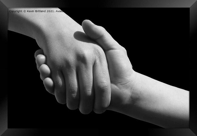 Handshake Framed Print by Kevin Britland