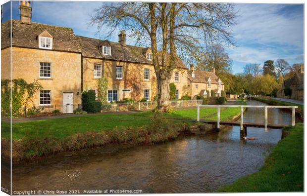 Lower Slaughter, idyllic riverside cottages Canvas Print by Chris Rose