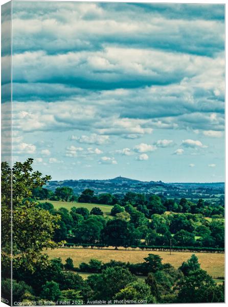 View of Glastonbury Tor in the distance and its surrounding countryside from summit of Cheddar Gorge Canvas Print by Mehul Patel