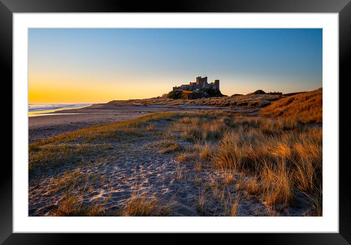 Sunrise at Bamburgh castle, Northumberland Framed Mounted Print by Michael Brookes