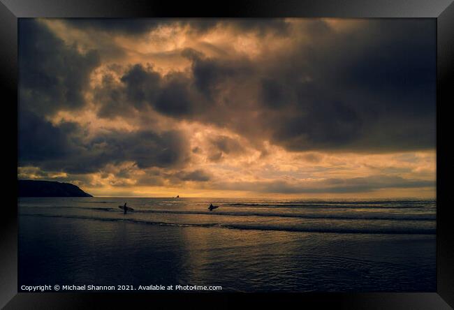 Surfers at Perranporth beach in Cornwall Framed Print by Michael Shannon