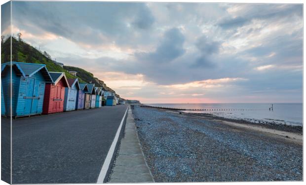 Beach huts along the Cromer seafront Canvas Print by Jason Wells