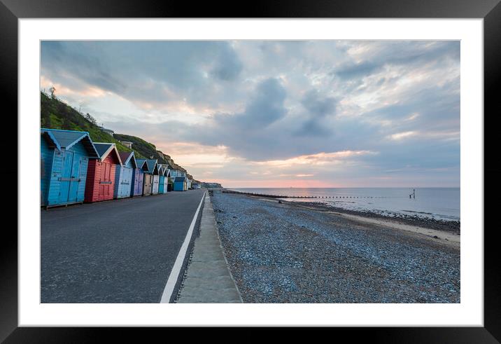 Beach huts along the Cromer seafront Framed Mounted Print by Jason Wells