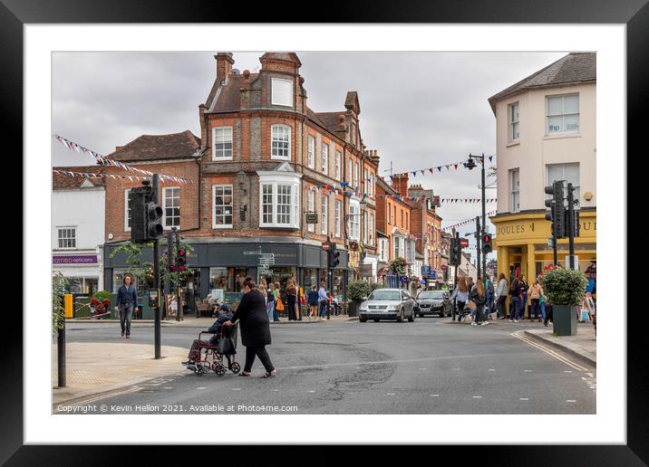 People shopping in the town centre.  Framed Mounted Print by Kevin Hellon