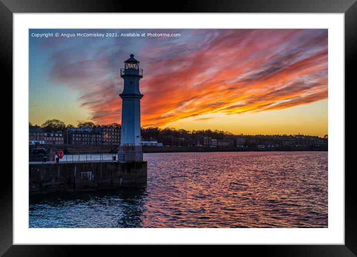 Dramatic sunset at Newhaven Lighthouse, Edinburgh Framed Mounted Print by Angus McComiskey