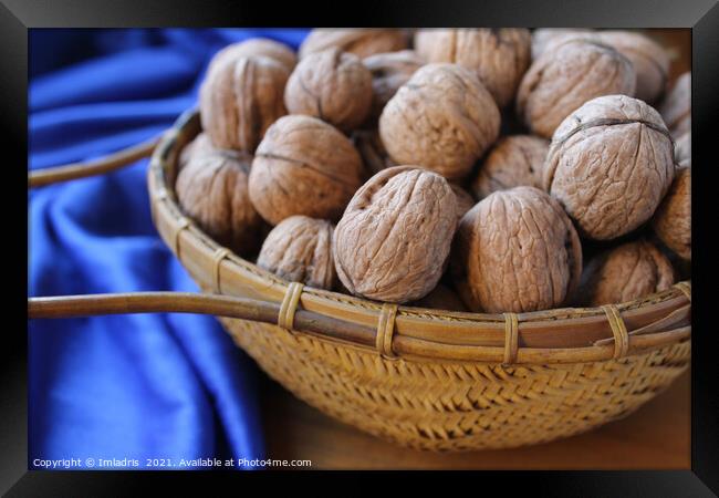 Walnuts in a basket with blue tablecloth Framed Print by Imladris 