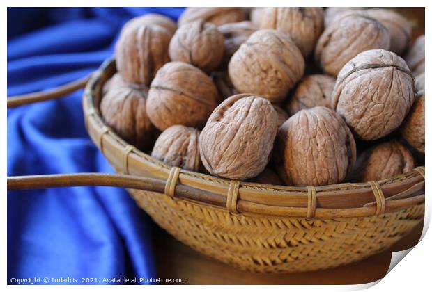 Walnuts in a basket with blue tablecloth Print by Imladris 