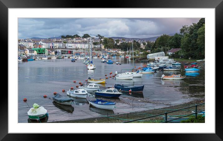 Boats lined up in Caernarfon Harbour Framed Mounted Print by Jason Wells