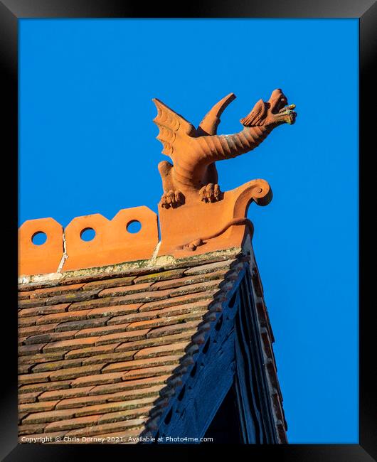 Dragon Sculpture on a Building in Winchester, UK Framed Print by Chris Dorney
