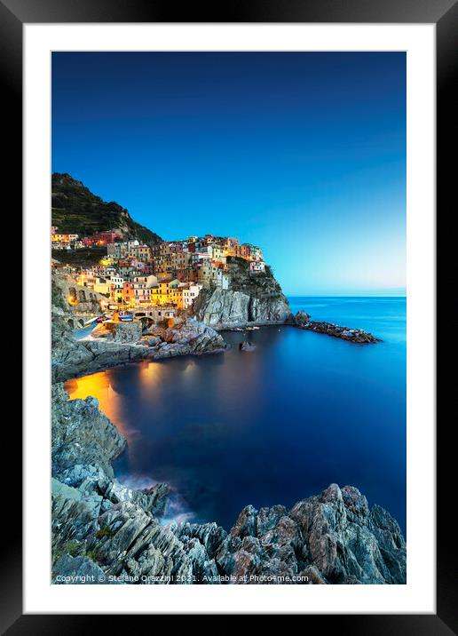 Manarola village, rocks and sea at sunset. Cinque Terre, Italy Framed Mounted Print by Stefano Orazzini