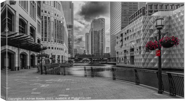 Canary Wharf, London in monochrome with selected colour Canvas Print by Adrian Rowley