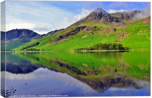 Mountain reflections, Cumbria, UK. Canvas Print by john hill