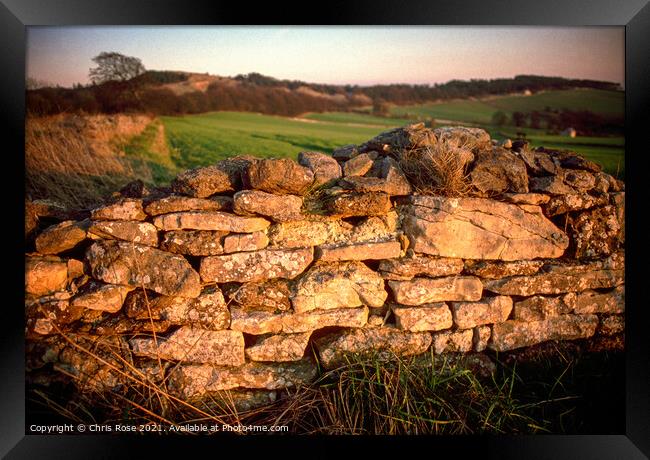 Cotswolds, late sun on a cotswold stone wall Framed Print by Chris Rose