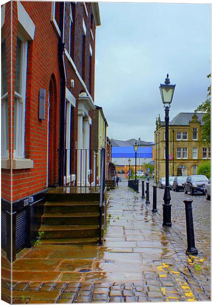 A Rainy Street in Blackburn Canvas Print by Jacqui Kilcoyne