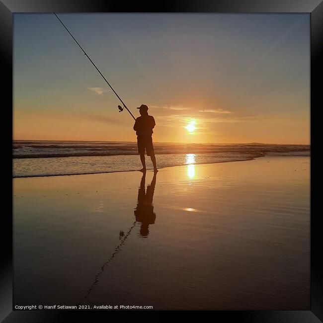 Fisherman on sand beach at sunset Squared Framed Print by Hanif Setiawan