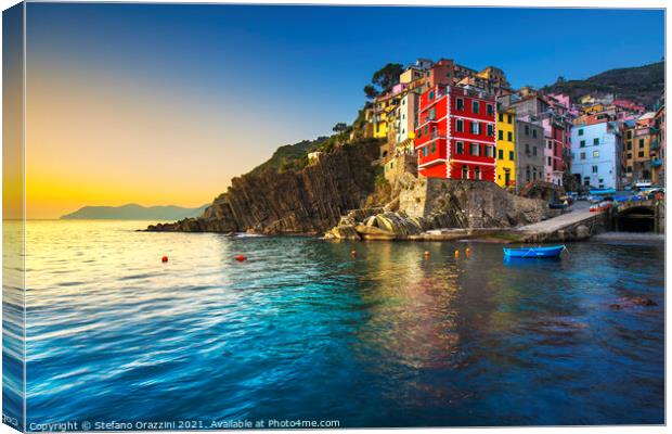 Riomaggiore town and sea at sunset. Cinque Terre Canvas Print by Stefano Orazzini