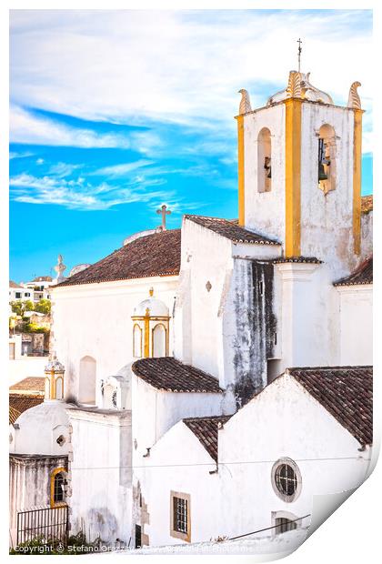Church and white facades in Tavira, Portugal Print by Stefano Orazzini
