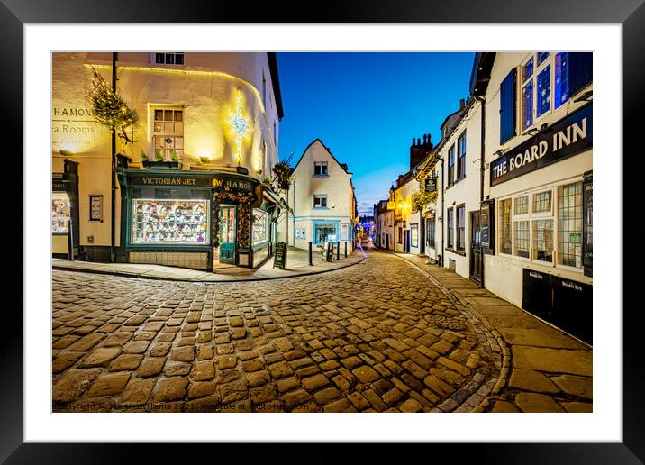 Christmas decorations on Church Street, Whitby, North Yorkshire Framed Mounted Print by Martin Williams