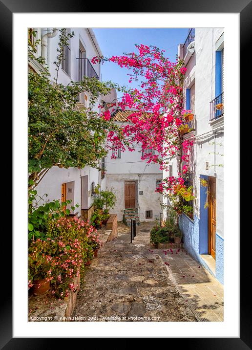 Narrow, hilly street in Ubrique Framed Mounted Print by Kevin Hellon
