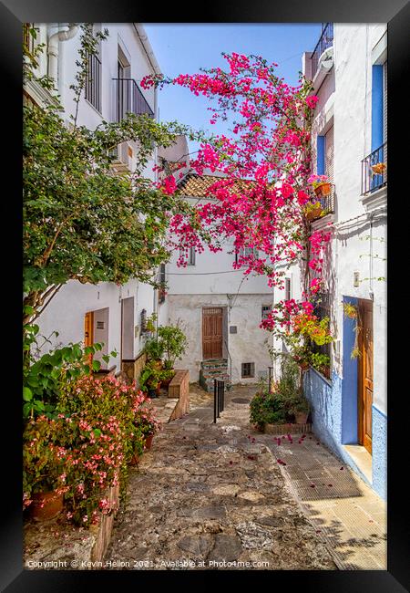 Narrow, hilly street in Ubrique Framed Print by Kevin Hellon
